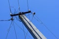 Energy Pole Blue Sky. Concrete pillar, electric wires. Power Supply, bend of energy line Royalty Free Stock Photo