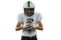 Close-up portrait of American football player in sports equipment, helmet and gloves isolated on white studio background Royalty Free Stock Photo