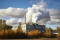 energy-producing biomass plant, with smoke billowing from the chimney