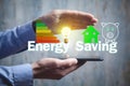 Energy Saving concept. Piggy bank, house, light bulb. Energy Efficiency Royalty Free Stock Photo