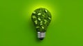 Energy-saving eco-lamp, made of green grass and leaves on a green background. LED lamp with green leaf. The concept of Royalty Free Stock Photo