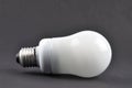 Energy saving lamp on black background Royalty Free Stock Photo