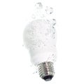 An energy saving light bulb falling into the water Royalty Free Stock Photo