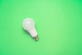 Energy saving light bulb on green background. Savings Royalty Free Stock Photo
