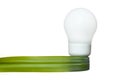 Energy saving light bulb with a green leaf ribbon Royalty Free Stock Photo