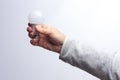 Energy saving light bulb in the hand of an adult