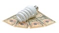 Energy saving light bulb and U.S. dollars Royalty Free Stock Photo
