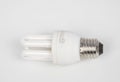 Energy-Saving Technology: Compact Fluorescent Light Bulb on White Royalty Free Stock Photo