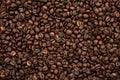 Energy stimulant and smooth java concept with full frame photograph of piled roasting coffee beans backgrounds