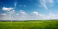 Energy wind farm on green field. Windmill turbines line generating electricity. Clean eco technology power. Green modern Royalty Free Stock Photo