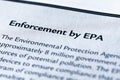 Closeup of the Enforcement by EPA or Environmental Protection Agency of the Government, printed in textbook on white page. Royalty Free Stock Photo