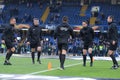 Football match officials warming up