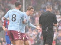 Jack Grealish argues with Kevin Friend