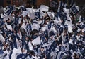 Tottenham Hotspur fans wave flags in the stands