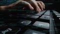 Close-Up of Hands Typing on Computer Keyboard with Programming Code Overlay, Symbolizing Software Development and Royalty Free Stock Photo