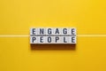 Engage people word concept on cubes