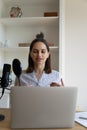 Engaged beautiful female blogger recording audio podcast Royalty Free Stock Photo