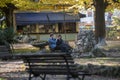 Engaged couple sitting at the park