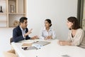Engaged serious Indian business leader man talking to diverse colleagues Royalty Free Stock Photo