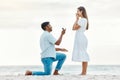 Engagement, beach and a couple with a marriage proposal with a ring while on romantic vacation. Love, romance and happy Royalty Free Stock Photo