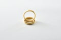 Engagement gold ring standing on each other isolated white