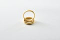 Engagement gold ring standing on each other isolated white Royalty Free Stock Photo