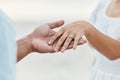 Engagement proposal, couple hand and marriage ring on vacation at beach, travel wedding and love celebration on sea Royalty Free Stock Photo