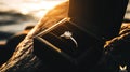 Engagement ring in box with sunset light Royalty Free Stock Photo