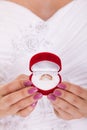 Engagement ring box in woman bride hands. Royalty Free Stock Photo