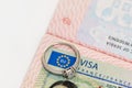 An engagement ring on a European visa stamp as a symbol of emigration or marriage