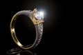 Engagement ring of yellow and white gold with sparkling diamond