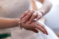Engagement rings at the hands of the newlyweds Royalty Free Stock Photo