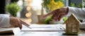 The engaging discussion between hands over a real estate contract on a desk. AI generated image Royalty Free Stock Photo