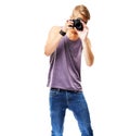 Engaging in his artistic passion. Studio shot of a casually dressed young man pointing a camera at the photographer Royalty Free Stock Photo