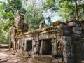 An engaging landscape depicting the tangle of the Cambodian forest with the remnants of ancient medieval architecture