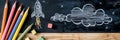 Launch Your Dreams: Rocket Drawing on Blackboard with Pencils Royalty Free Stock Photo