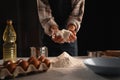 Engaging in the process of adding flour to the mixture as part of the preparation for baking Royalty Free Stock Photo