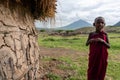 ENGARE SERO. TANZANIA - JANUARY 2020: Indigenous Maasai Boy near the Clay Hut in Traditional Village. Maasailand is the