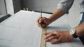 Engeneer`s hands making a drawing in the workshop Royalty Free Stock Photo
