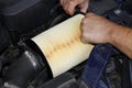 Engine air filter part change by auto mechanic Royalty Free Stock Photo
