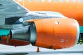 Engine of the airplane painted in orange. Close-up