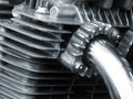 Engine of an old vintage motorcycle with black frame and shiny chrome exhaust pipes Royalty Free Stock Photo