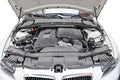 Engine of BMW 335i car - bonnet open position