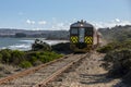 A Red Hen train runs along the railway line near Victor Harbor in South Australia.