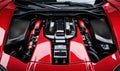Engine compartment supercar, red accents, carbon fiber components, high-performance design, intricate engineering Royalty Free Stock Photo
