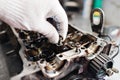 Engine crankshaft, valve cover, pistons. mechanic repairman at automobile car engine maintenance repair work Royalty Free Stock Photo