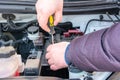 Engine engineer is replacing car battery because car battery is depleted. concept car maintenance