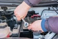 Engine engineer is replacing car battery because car battery is depleted. concept car maintenance