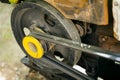 The engine of a garden walk-behind tractor close-up. Yellow Pulley Belt Driven Torque Transmission Royalty Free Stock Photo