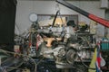 Engine hanging on crane hook on car repair service. Photo of old engine hanging on a cable. Engine hanging for overhaul. Royalty Free Stock Photo